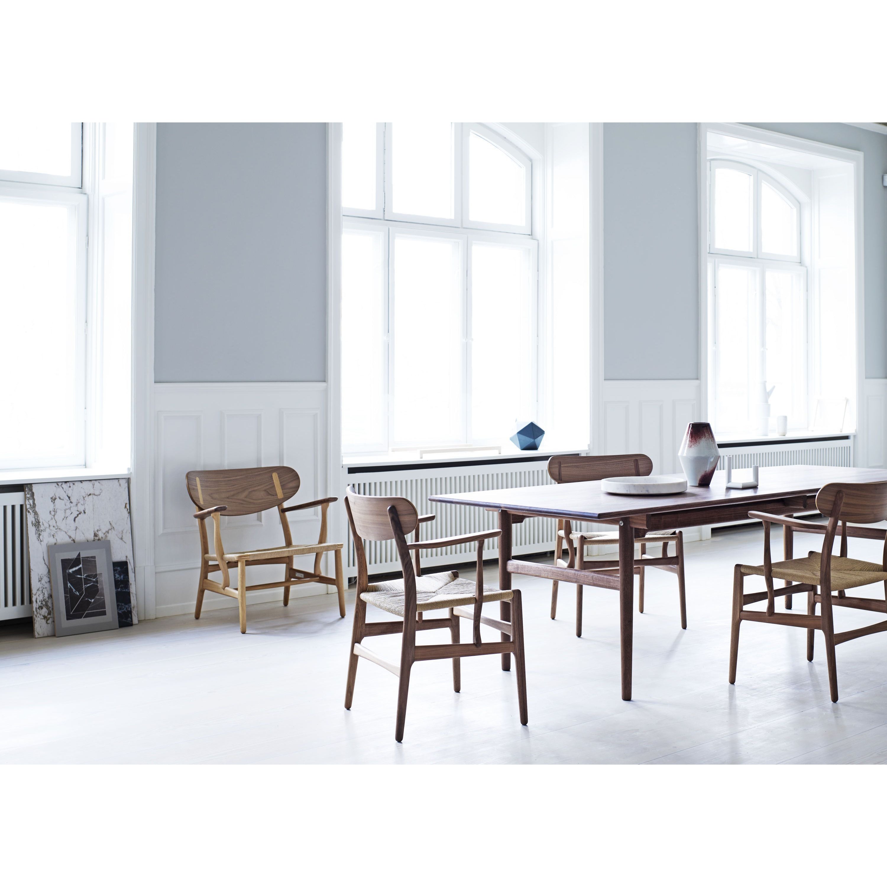 Carl Hansen CH22 Lounge -stoel, zwarte eiken/natuurlijke rieten